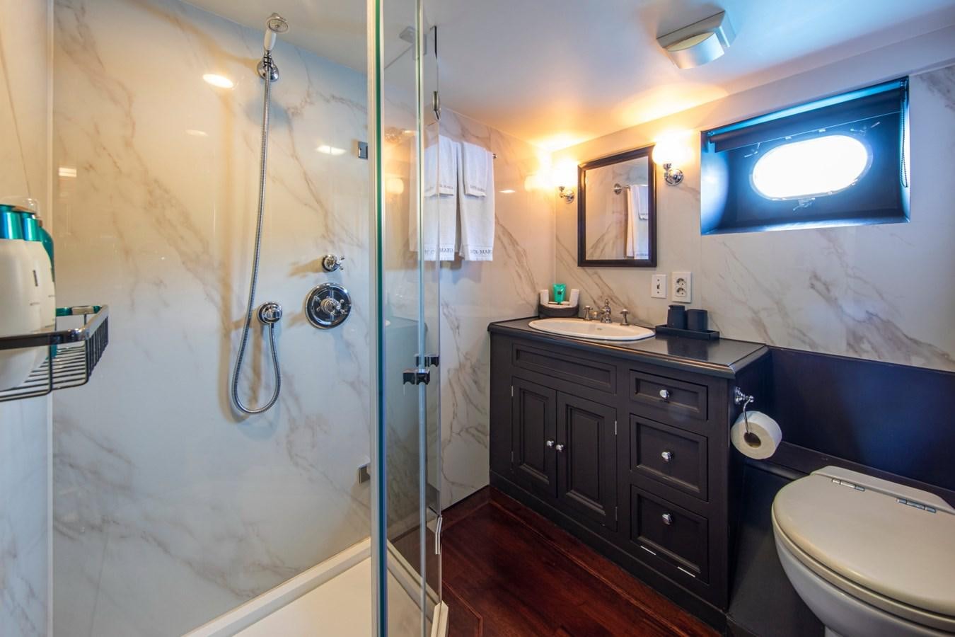 a bathroom with a shower and a sink aboard SANTA MARIA Yacht for Sale