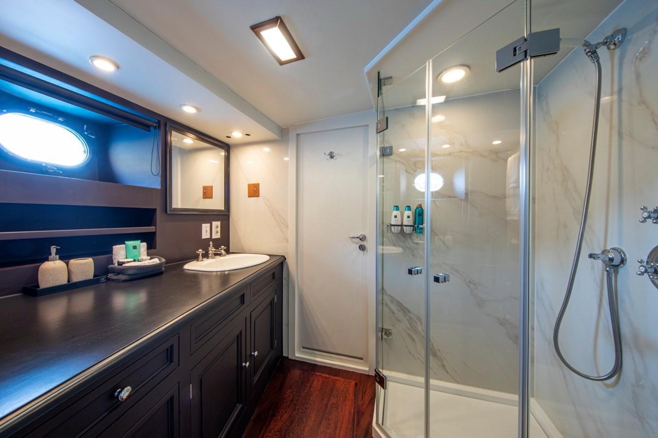 a bathroom with a glass shower aboard SANTA MARIA Yacht for Sale