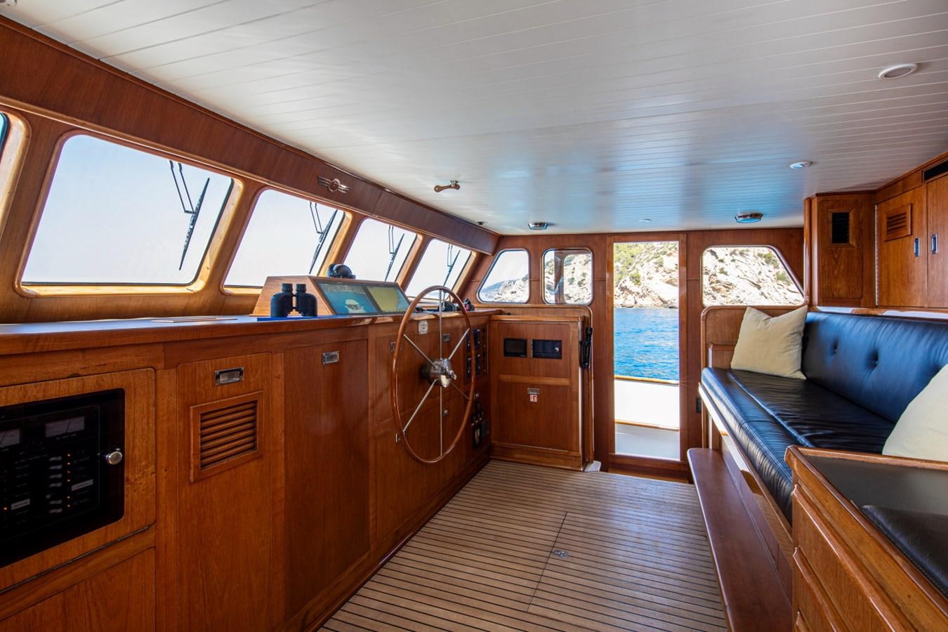 a cabin with a large open window aboard SANTA MARIA Yacht for Sale