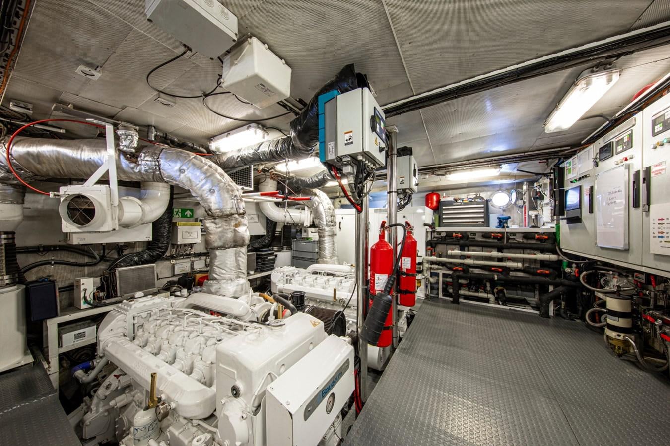a room with machinery and pipes aboard SANTA MARIA Yacht for Sale