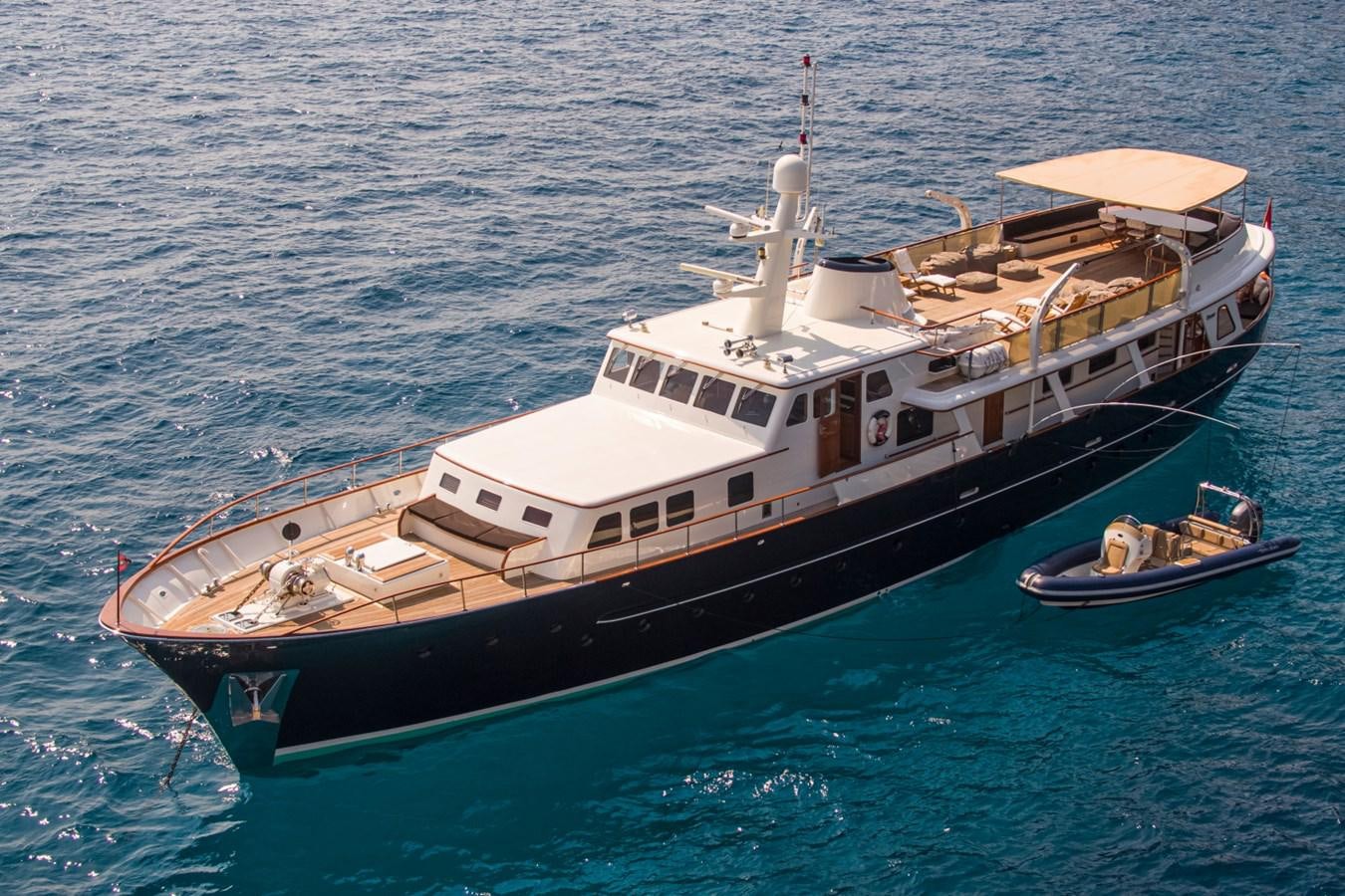 a boat with a couple of people on it aboard SANTA MARIA Yacht for Sale