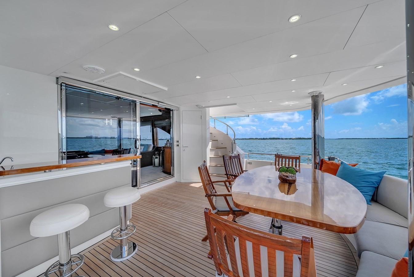 a room with a table and chairs aboard 101' HARGRAVE Yacht for Sale