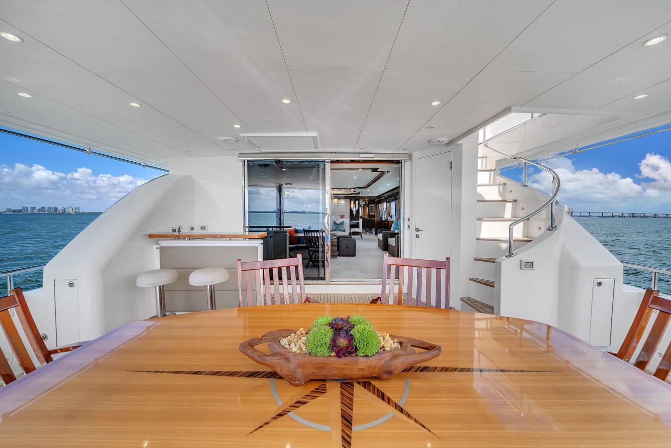 a table with plants on it aboard 101' HARGRAVE Yacht for Sale