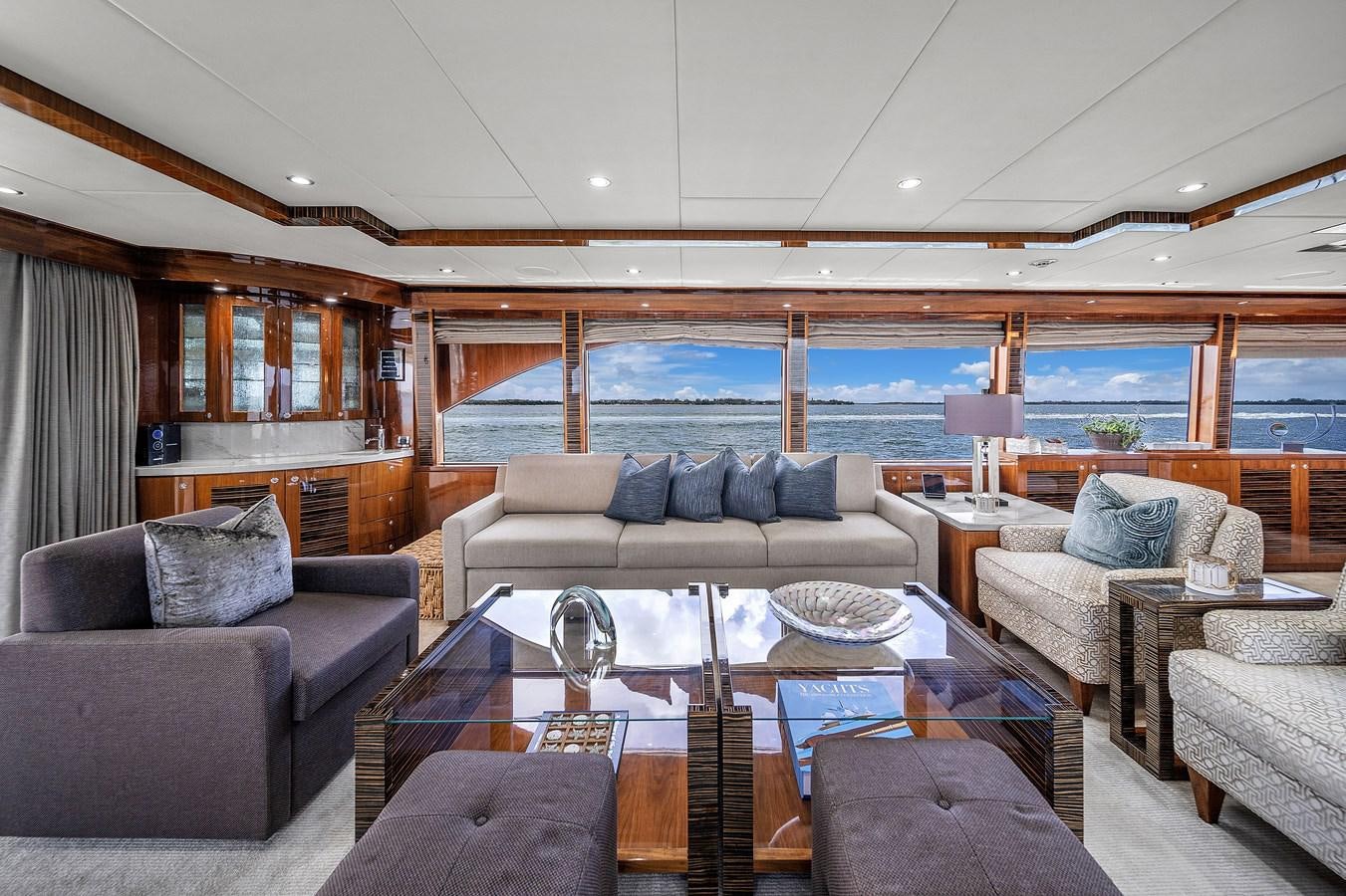 a living room with a large glass window aboard 101' HARGRAVE Yacht for Sale