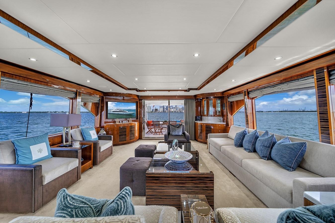 a living room with a large window aboard 101' HARGRAVE Yacht for Sale