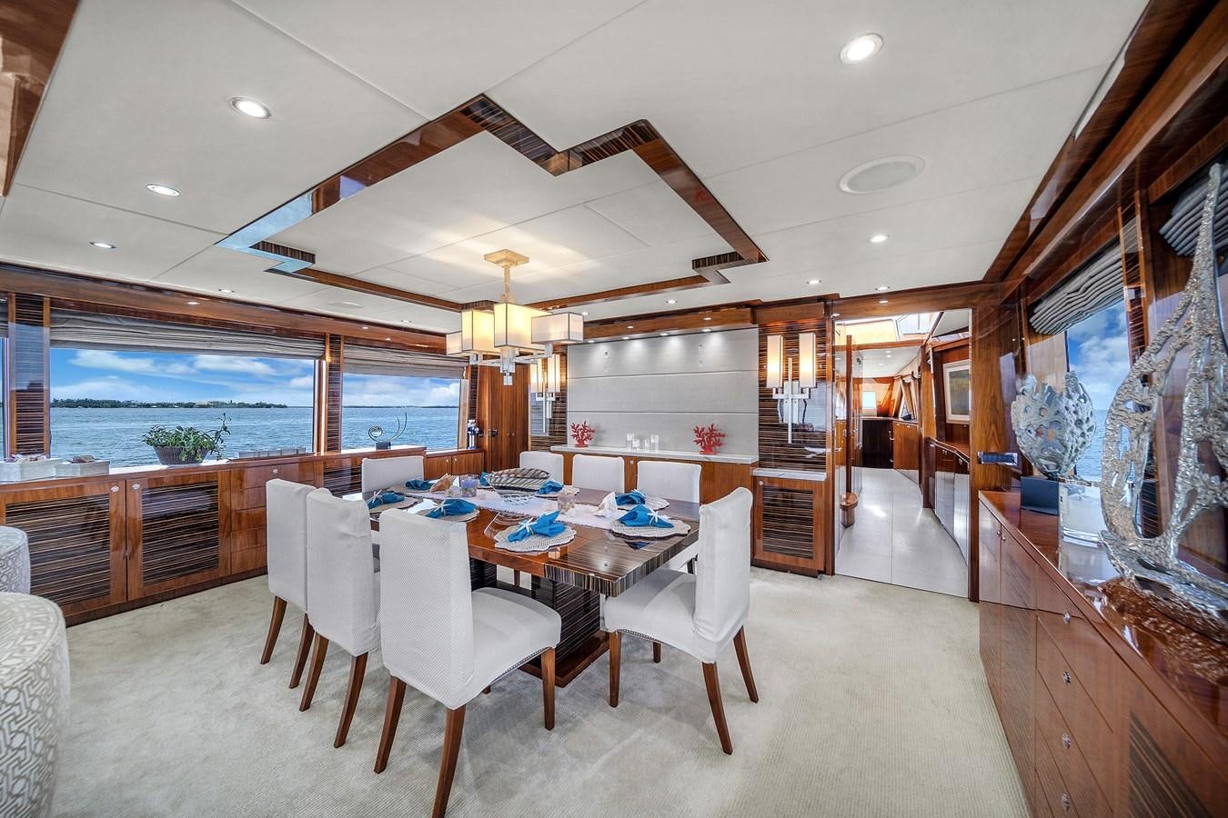 a dining room with a large window aboard 101' HARGRAVE Yacht for Sale