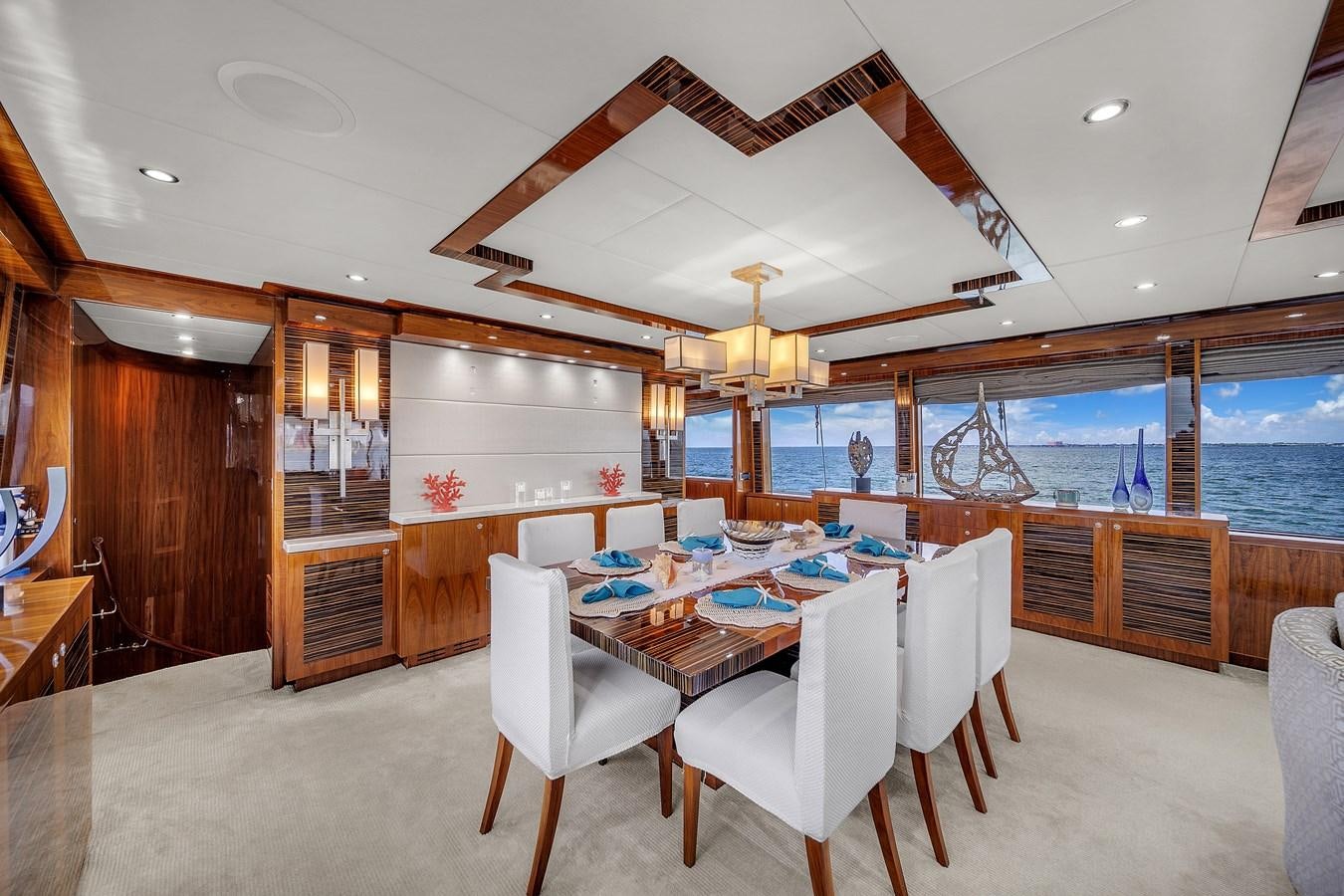 a dining room with a table and chairs aboard 101' HARGRAVE Yacht for Sale