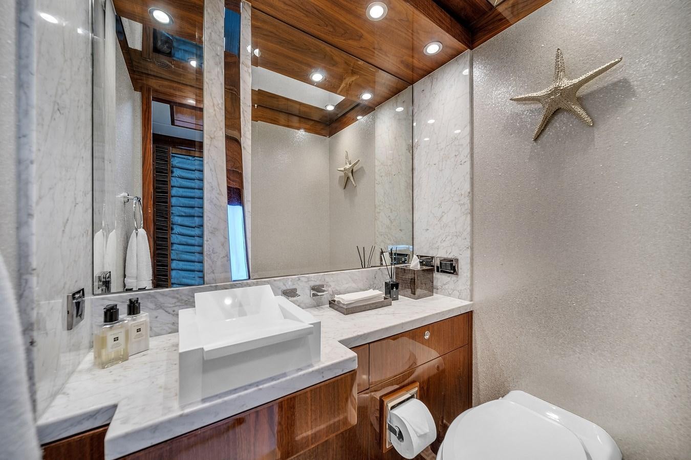 a bathroom with a sink and a mirror aboard 101' HARGRAVE Yacht for Sale