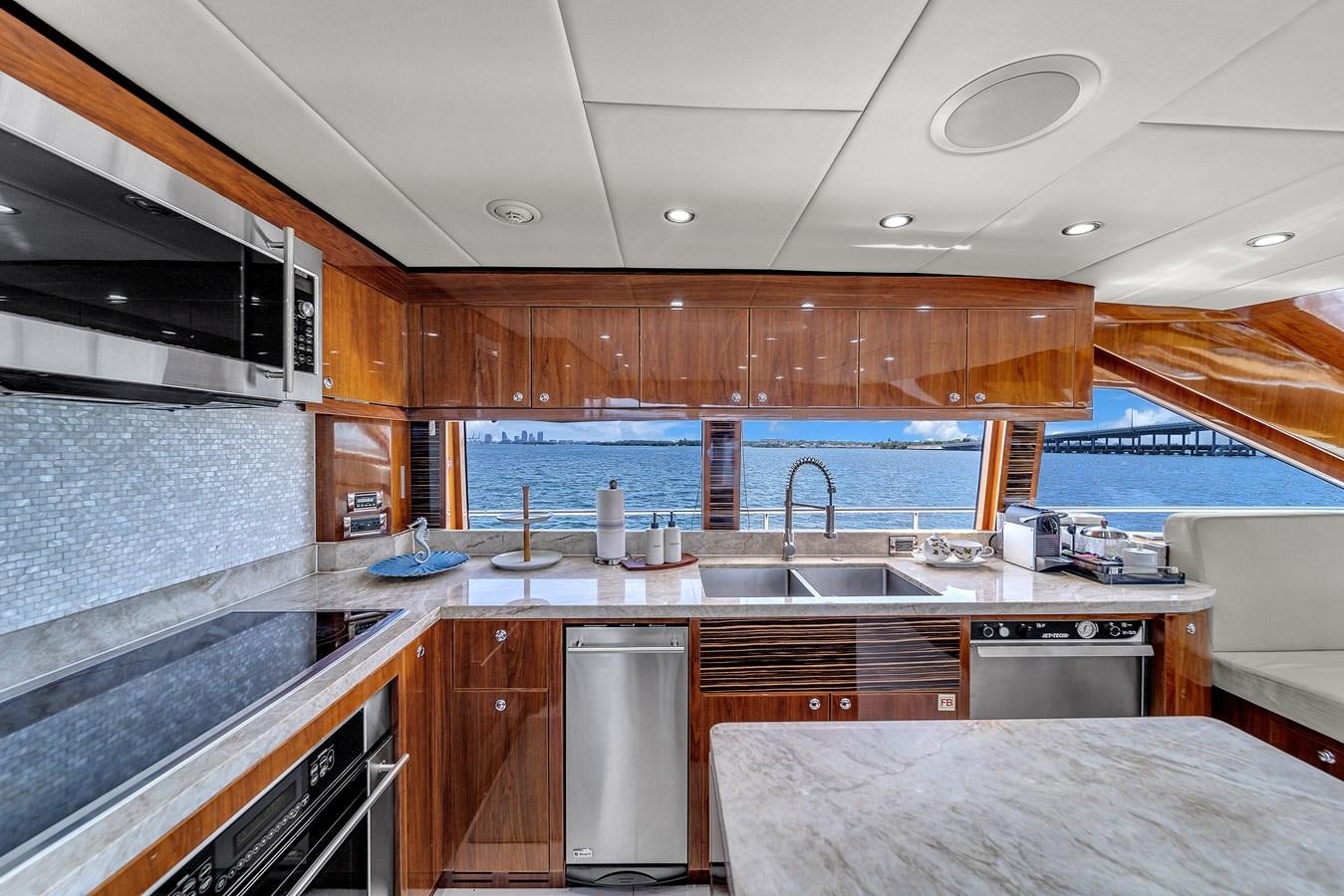 a kitchen with a large island aboard 101' HARGRAVE Yacht for Sale