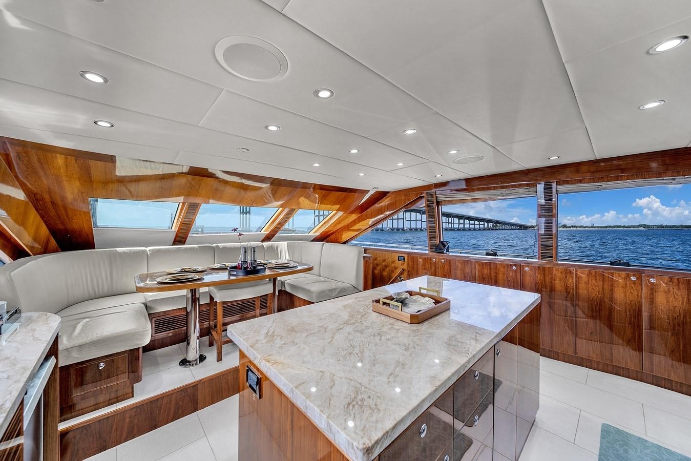 a room with a table and chairs aboard 101' HARGRAVE Yacht for Sale