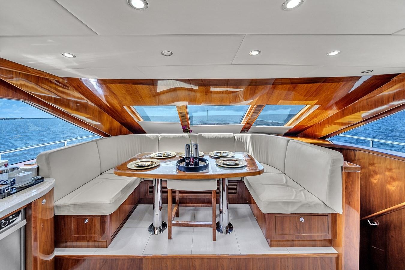 a room with a couch and a table and chairs aboard 101' HARGRAVE Yacht for Sale