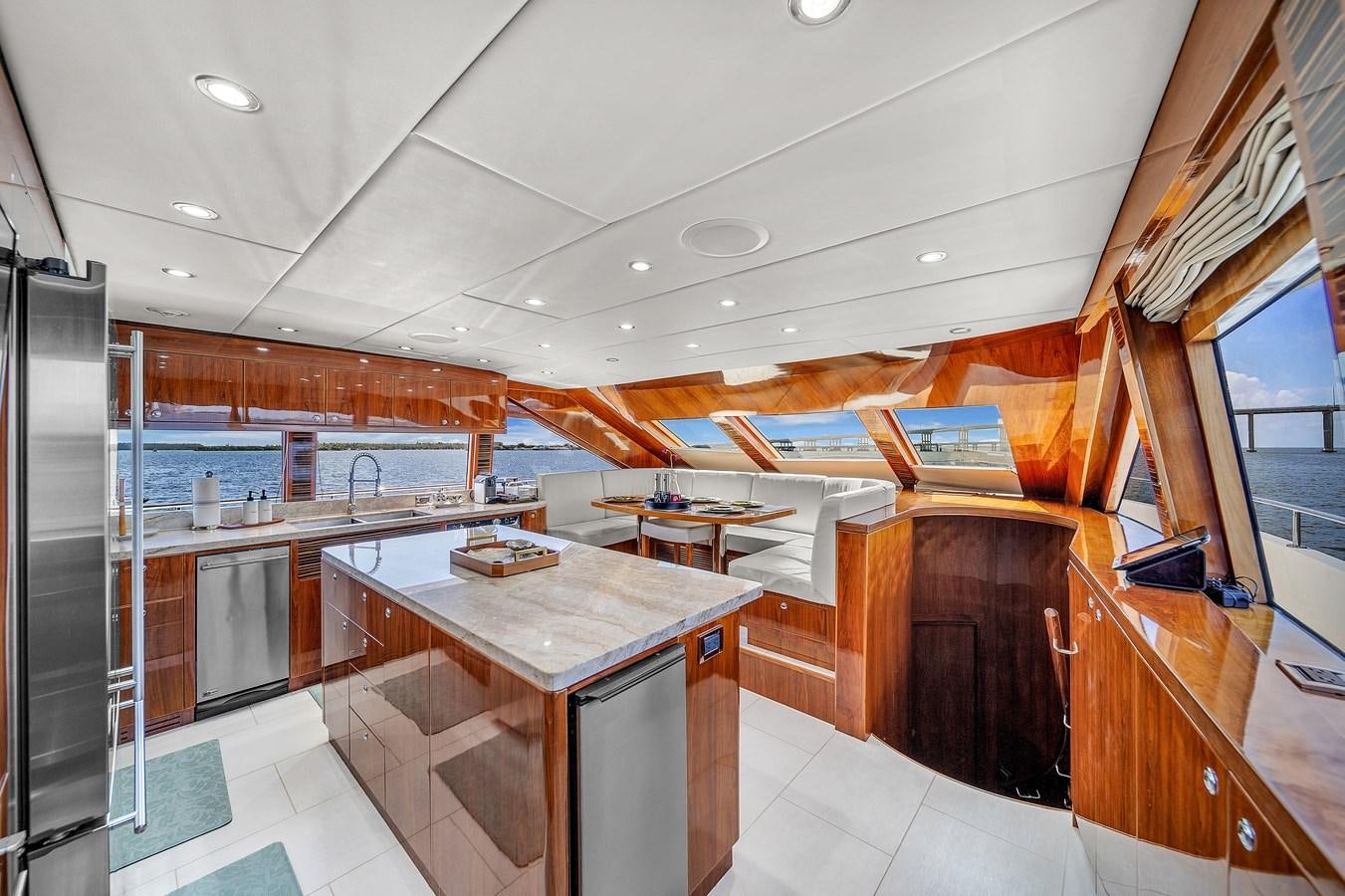 a kitchen with a bar and a bar aboard 101' HARGRAVE Yacht for Sale