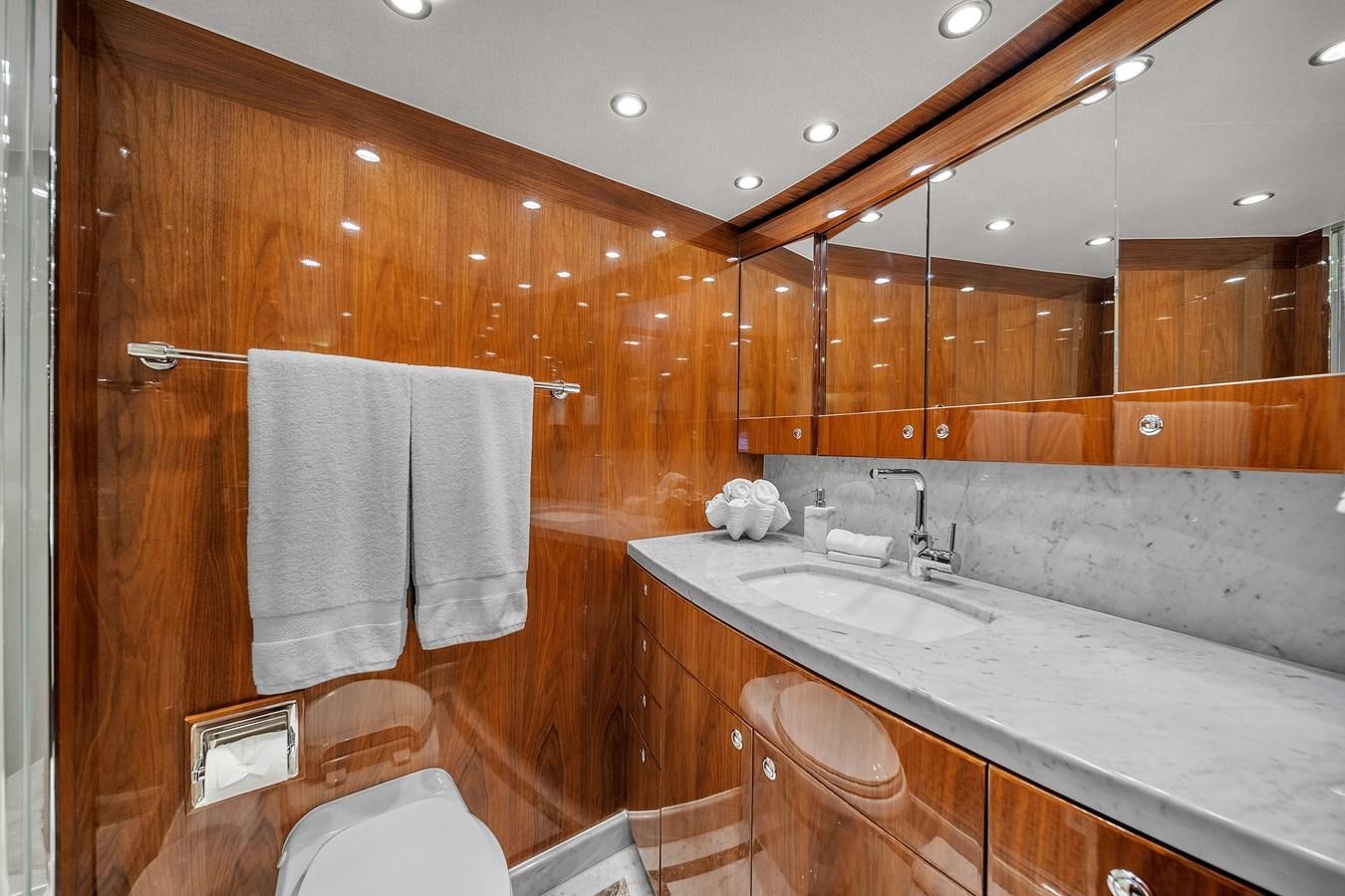 a bathroom with a large mirror aboard 101' HARGRAVE Yacht for Sale