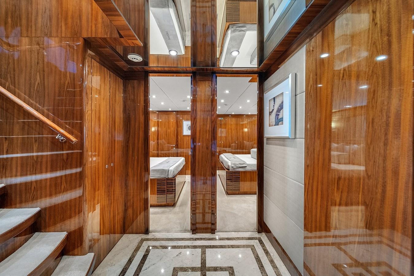 a room with wooden walls and a large mirror aboard 101' HARGRAVE Yacht for Sale