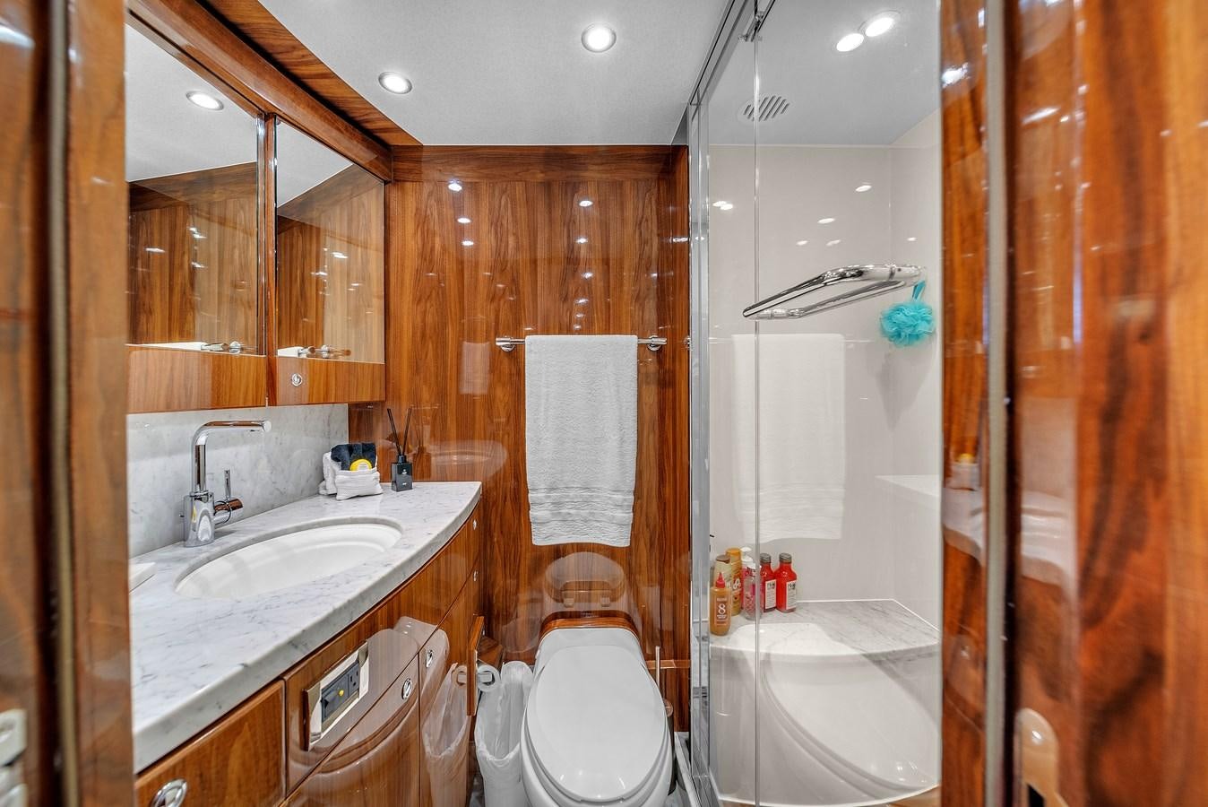 a bathroom with a sink toilet and shower aboard 101' HARGRAVE Yacht for Sale
