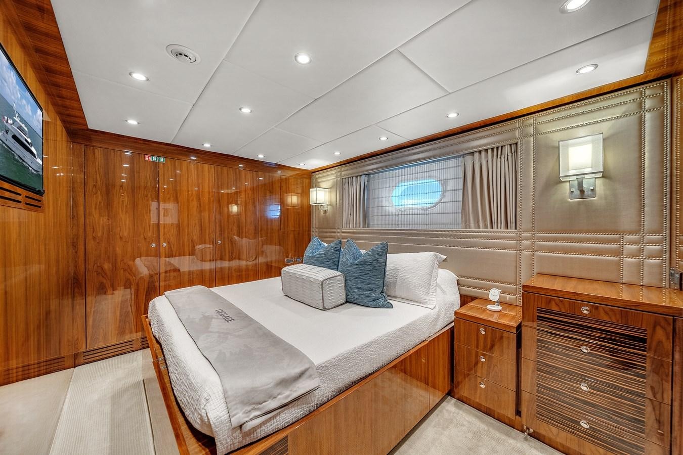 a room with a bed and a tv aboard 101' HARGRAVE Yacht for Sale