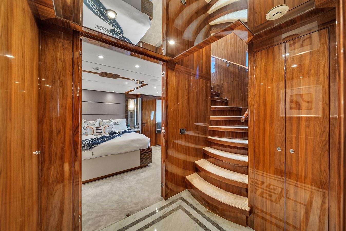 a wooden room with a bed and a wooden door aboard 101' HARGRAVE Yacht for Sale