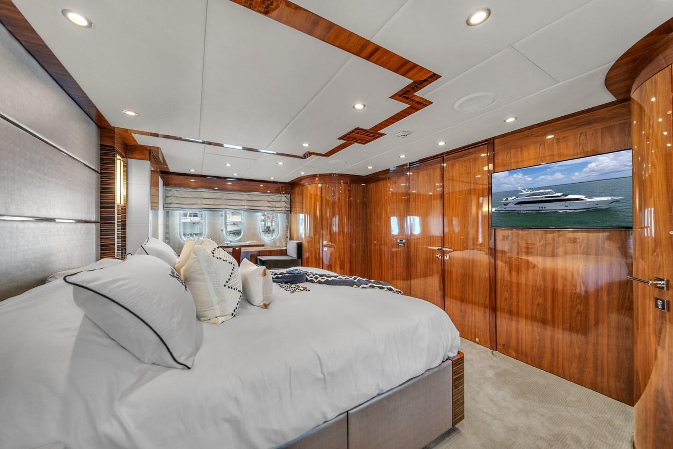 a room with a bed and a wood wall aboard 101' HARGRAVE Yacht for Sale