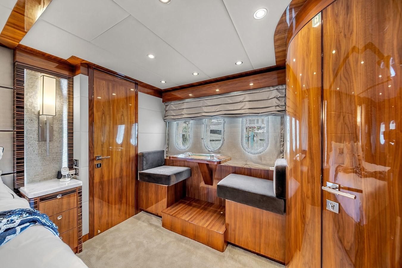 a room with a bed and a wood door aboard 101' HARGRAVE Yacht for Sale