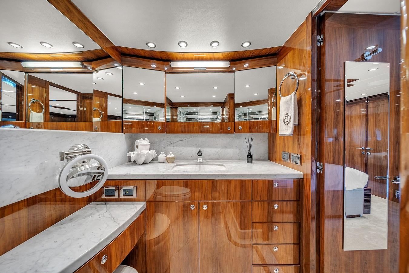a kitchen with wooden cabinets aboard 101' HARGRAVE Yacht for Sale