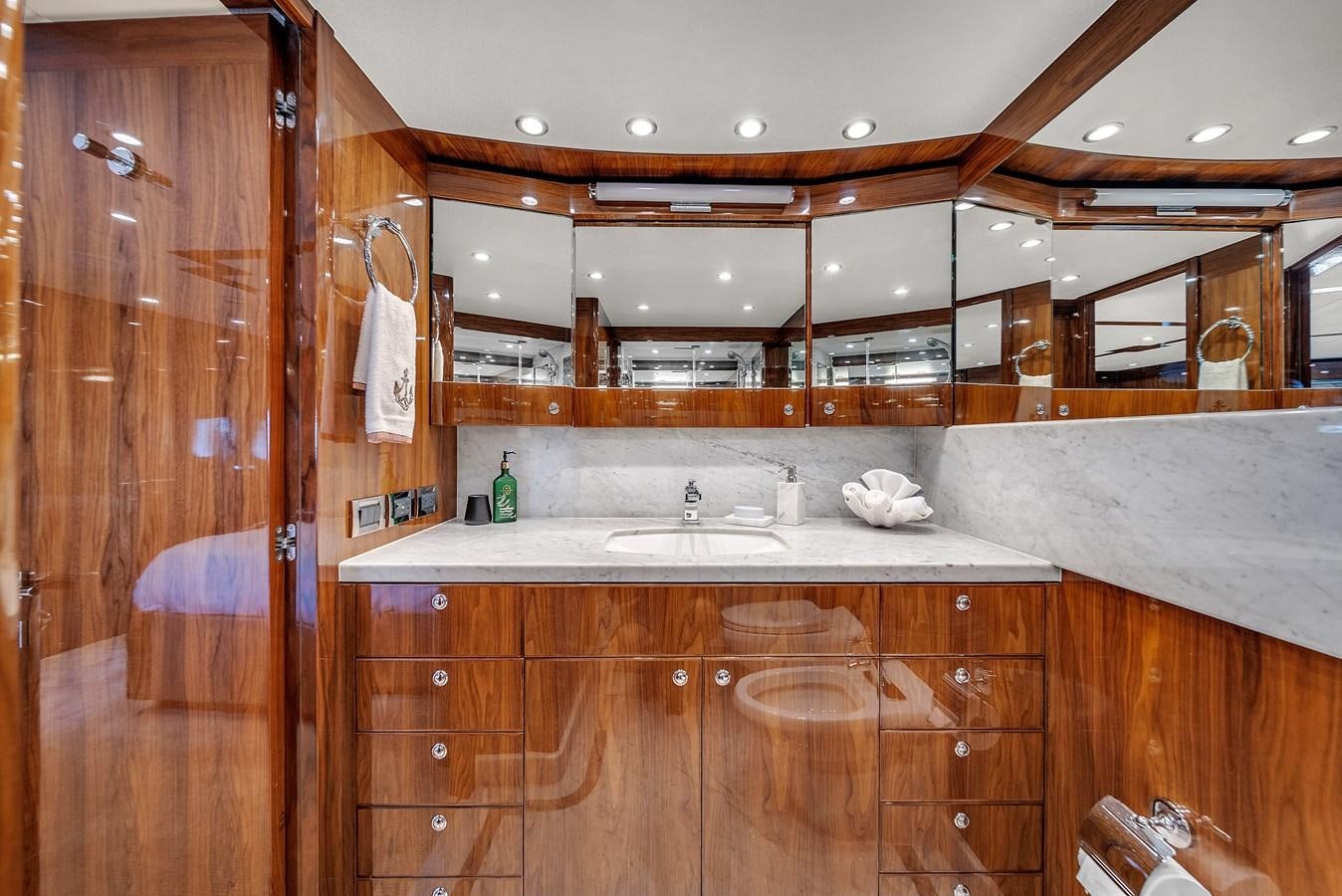 a kitchen with wooden cabinets aboard 101' HARGRAVE Yacht for Sale