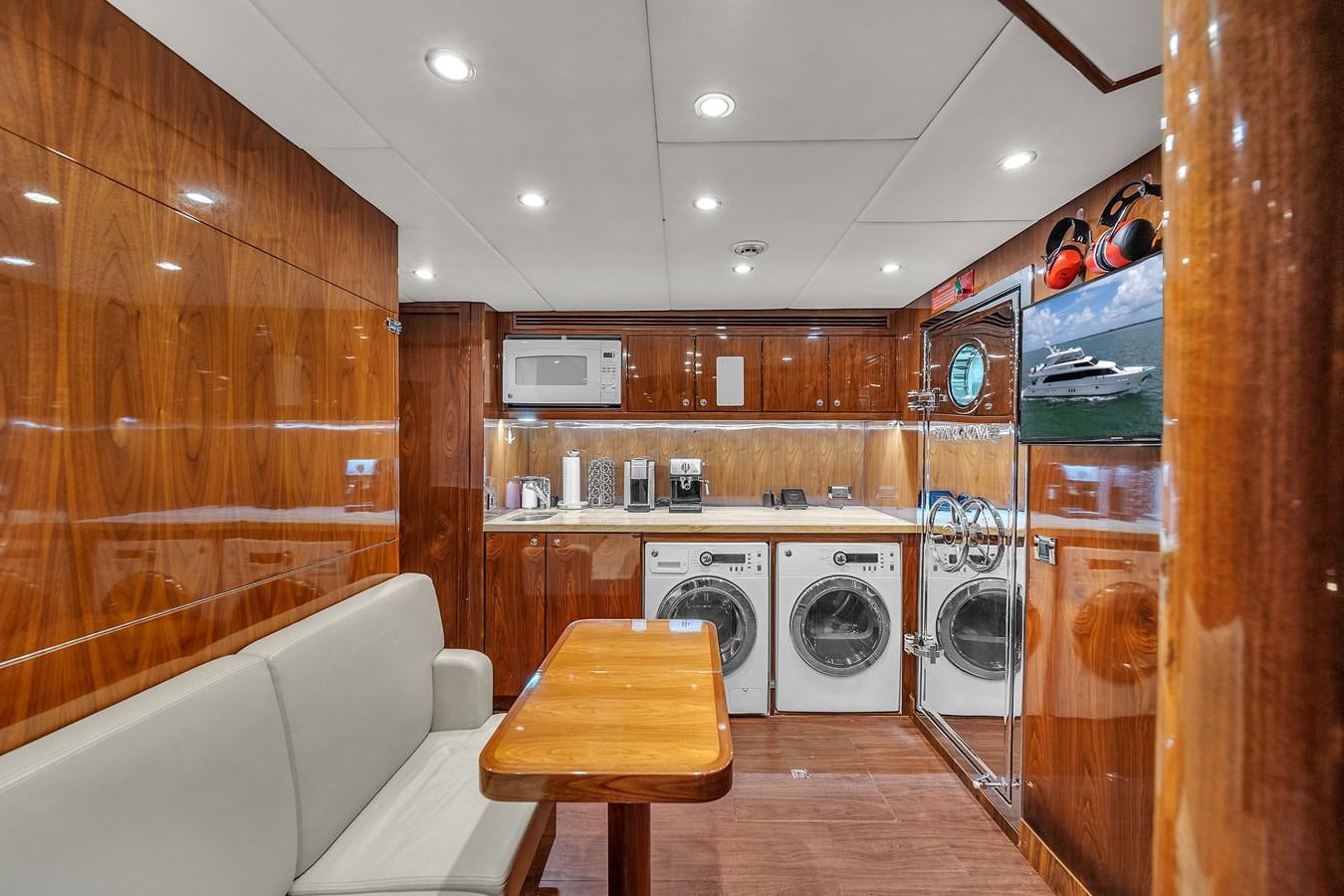a kitchen with wooden cabinets aboard 101' HARGRAVE Yacht for Sale