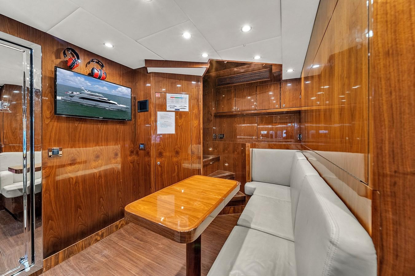 a room with a bed and a table aboard 101' HARGRAVE Yacht for Sale