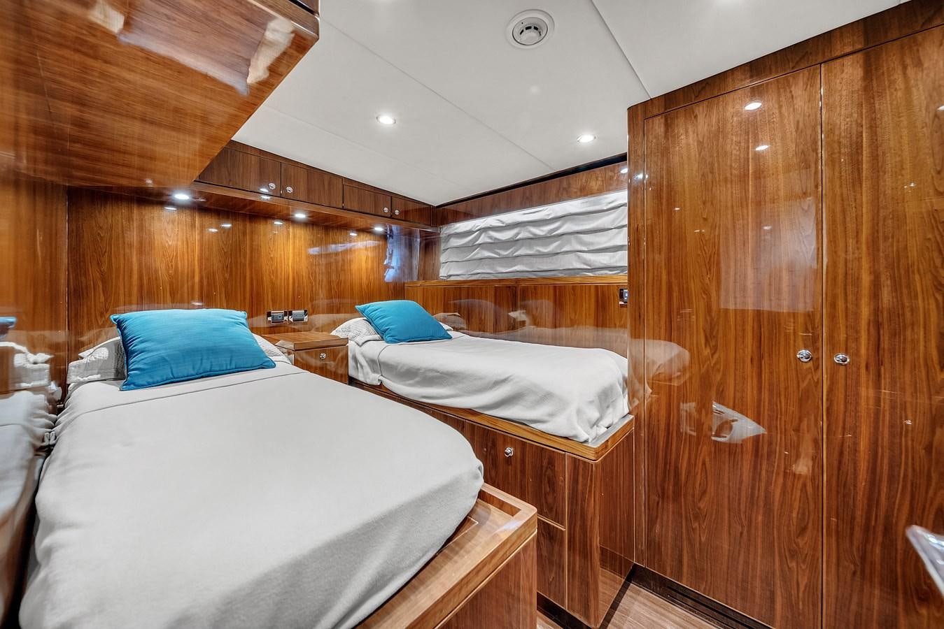 a room with wooden walls and a couple of beds aboard 101' HARGRAVE Yacht for Sale