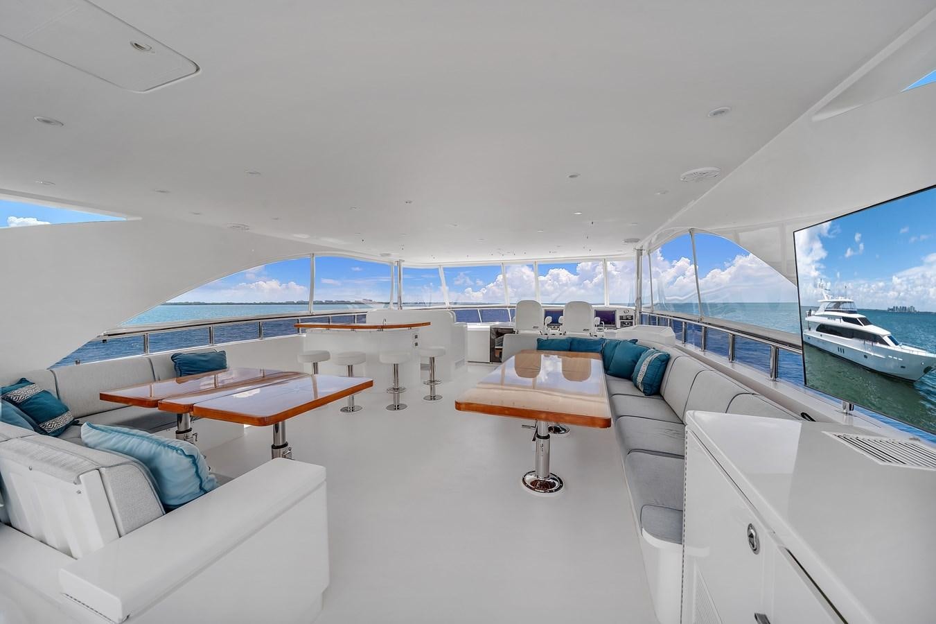 inside of a room with a view of the ocean and the deck aboard 101' HARGRAVE Yacht for Sale
