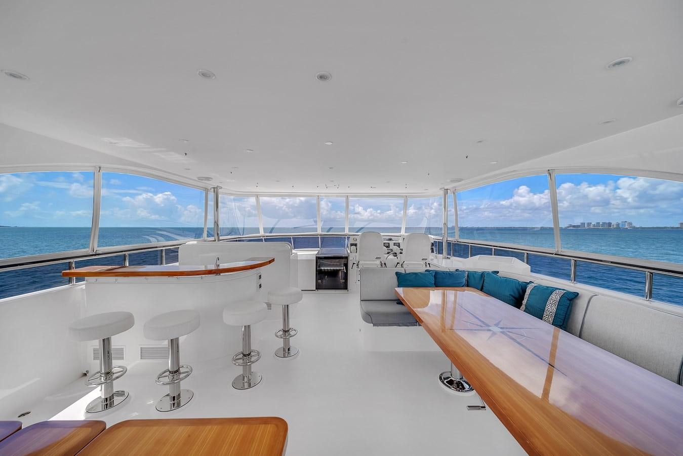 a room with a bed and a table and chairs aboard 101' HARGRAVE Yacht for Sale