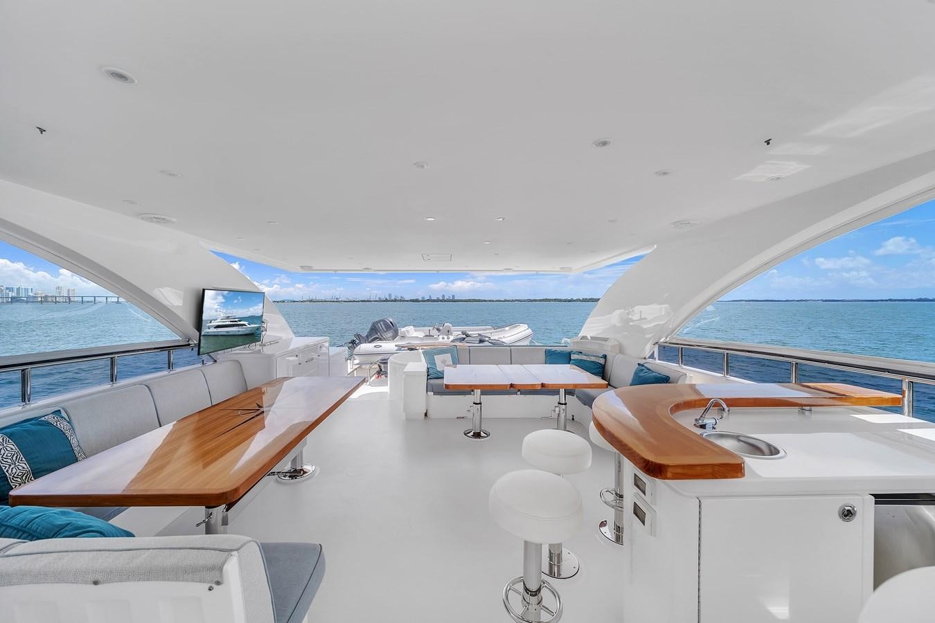 a room with a view of the water and the deck aboard 101' HARGRAVE Yacht for Sale