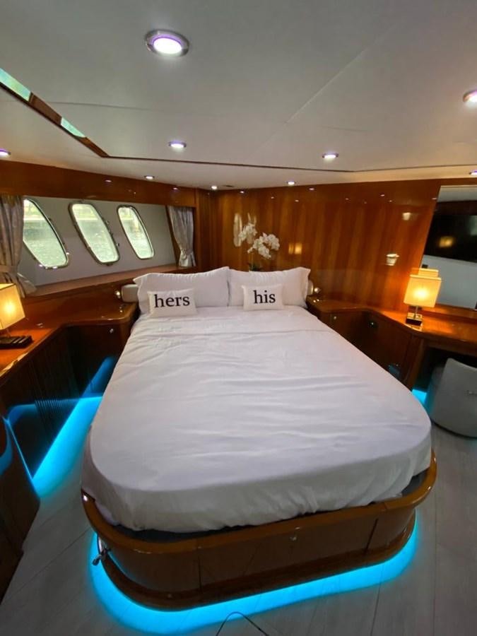 a bed with a white sheet aboard SOUL MATES Yacht for Sale