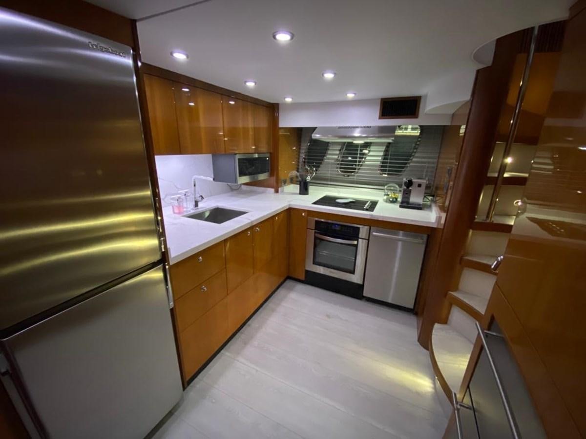 a kitchen with a fridge and oven aboard SOUL MATES Yacht for Sale