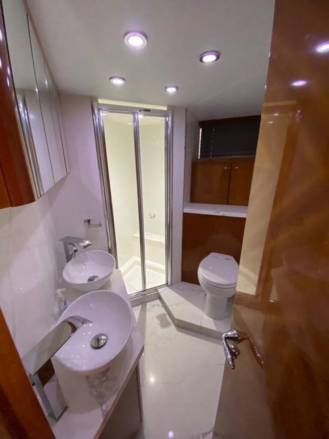 a bathroom with a tub sink and toilet aboard SOUL MATES Yacht for Sale