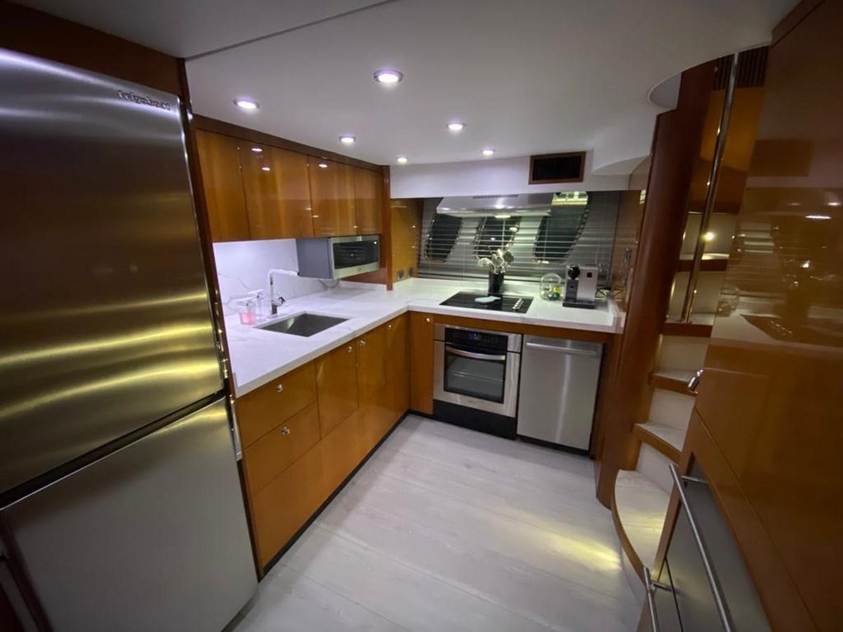 a kitchen with a fridge and oven aboard SOUL MATES Yacht for Sale