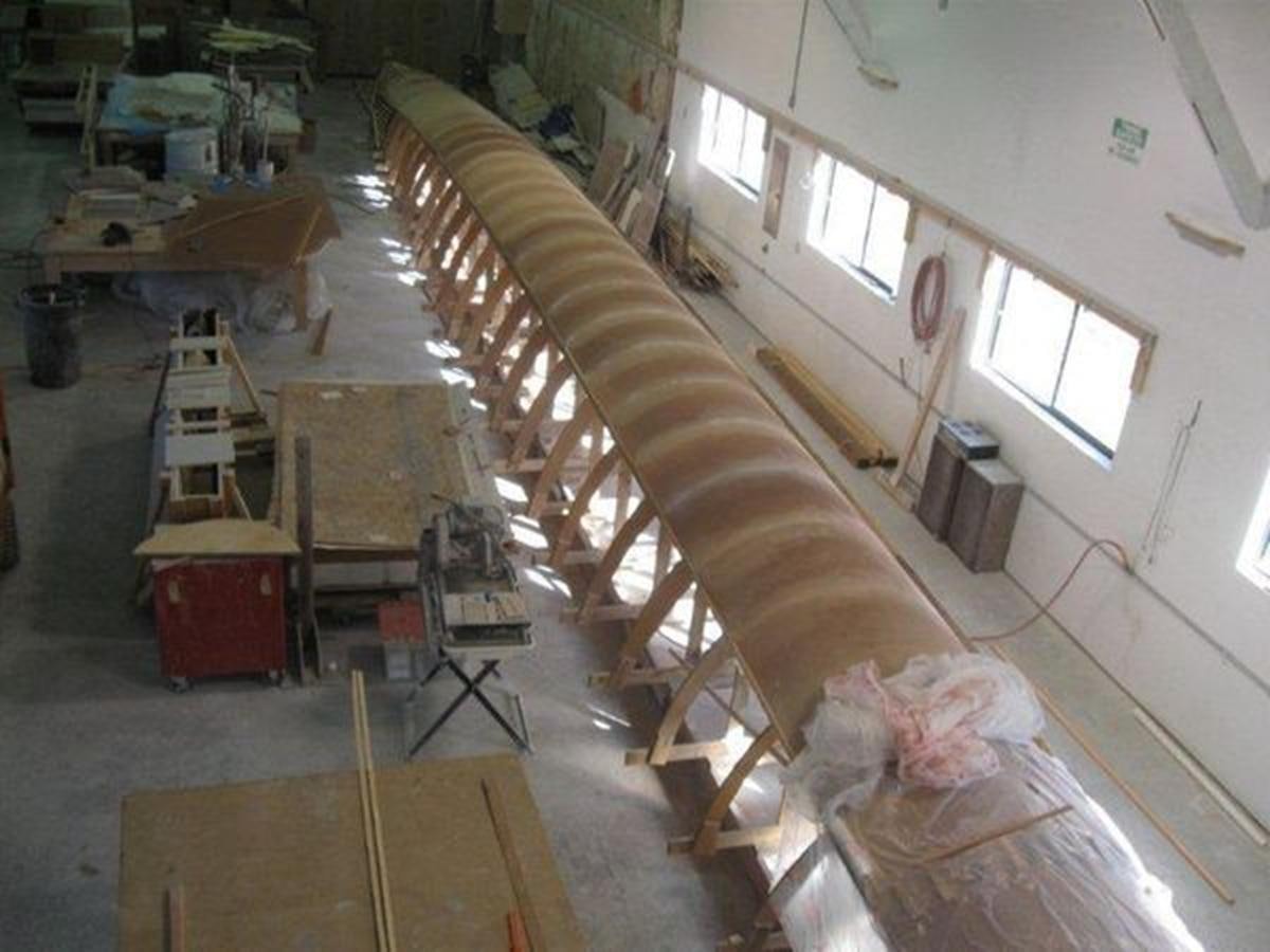 a room with a staircase and furniture aboard 2023 PDIGREE CAT BLOOMFIELD Yacht for Sale