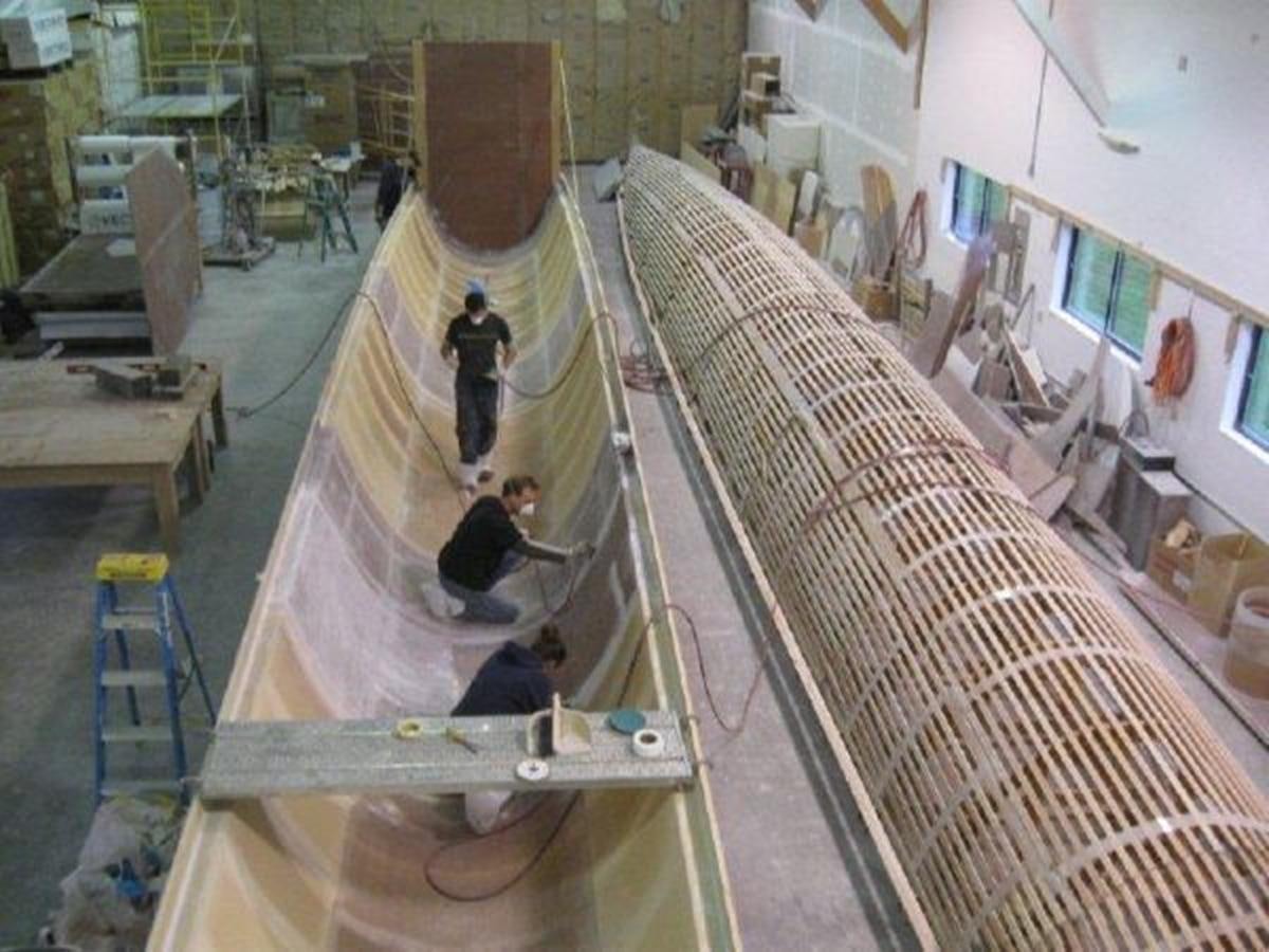 a group of people working in a factory aboard 2023 PDIGREE CAT BLOOMFIELD Yacht for Sale