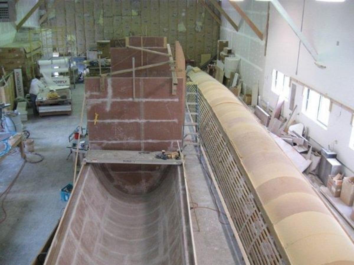 a large room with brick walls aboard 2023 PDIGREE CAT BLOOMFIELD Yacht for Sale