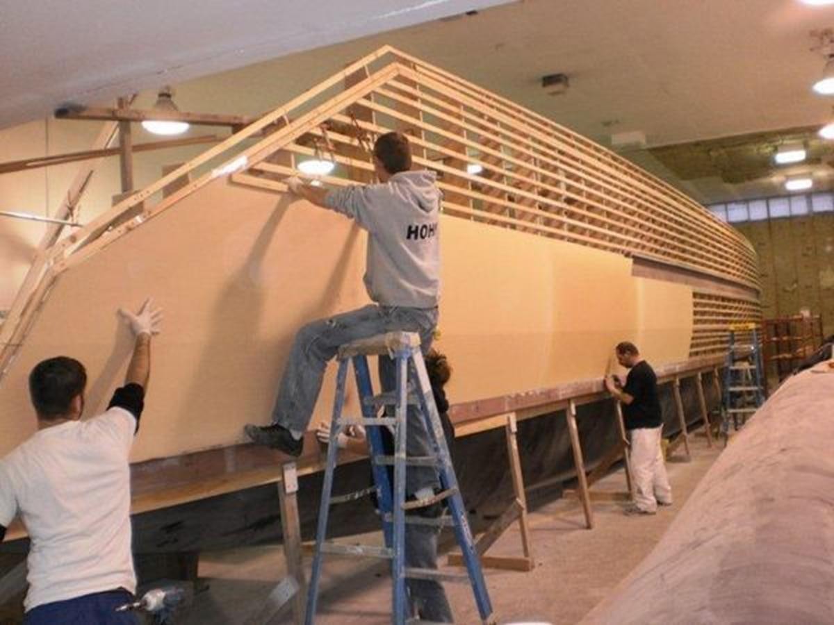 a man on a ladder aboard 2023 PDIGREE CAT BLOOMFIELD Yacht for Sale