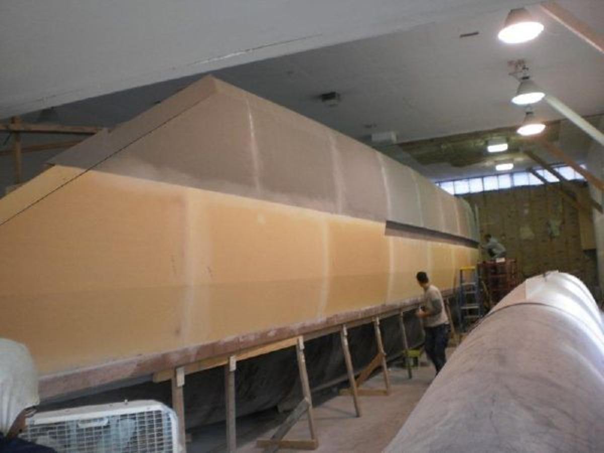 a man standing on a ladder aboard 2023 PDIGREE CAT BLOOMFIELD Yacht for Sale