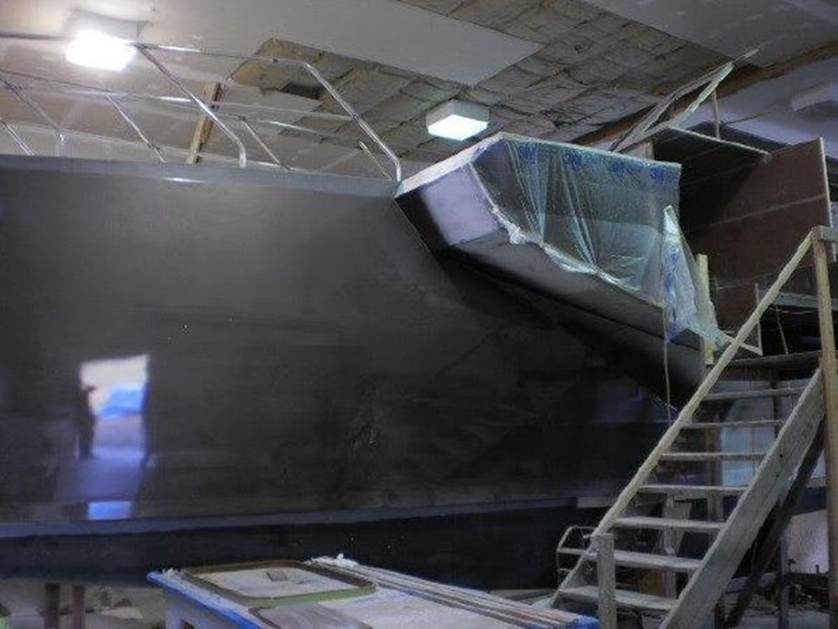 a large room with a ladder and a large piece of artwork aboard 2023 PDIGREE CAT BLOOMFIELD Yacht for Sale