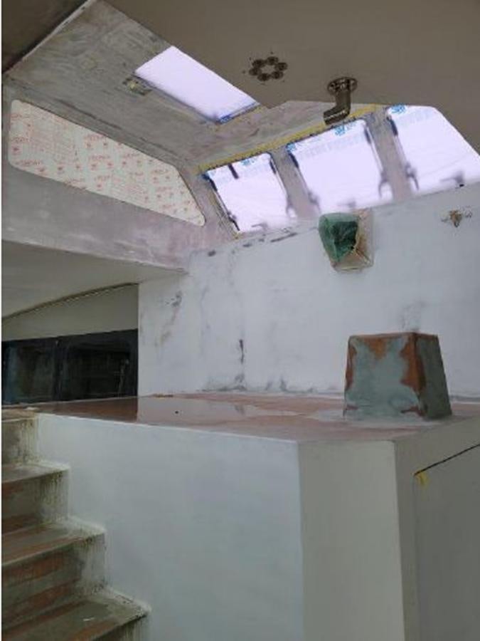 a room with a staircase and a painting on the wall aboard 2023 PDIGREE CAT BLOOMFIELD Yacht for Sale