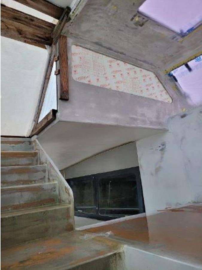 a fireplace in a room aboard 2023 PDIGREE CAT BLOOMFIELD Yacht for Sale