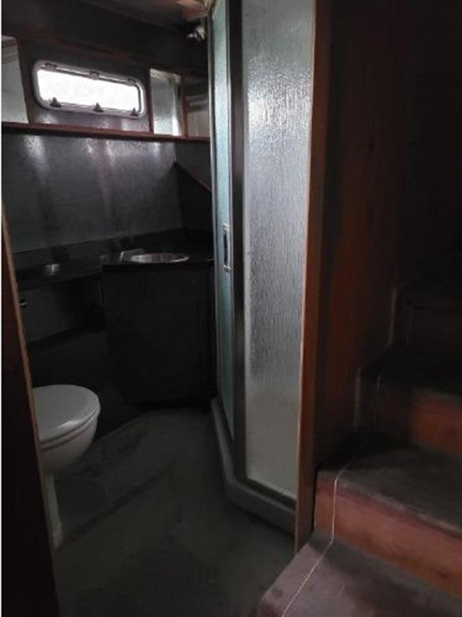 a bathroom with a toilet and a sink aboard 2023 PDIGREE CAT BLOOMFIELD Yacht for Sale