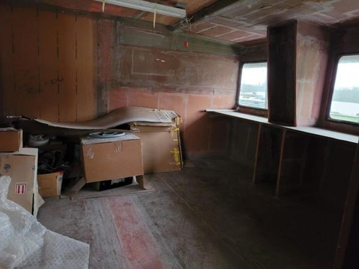 a room with a lot of boxes and a window aboard 2023 PDIGREE CAT BLOOMFIELD Yacht for Sale
