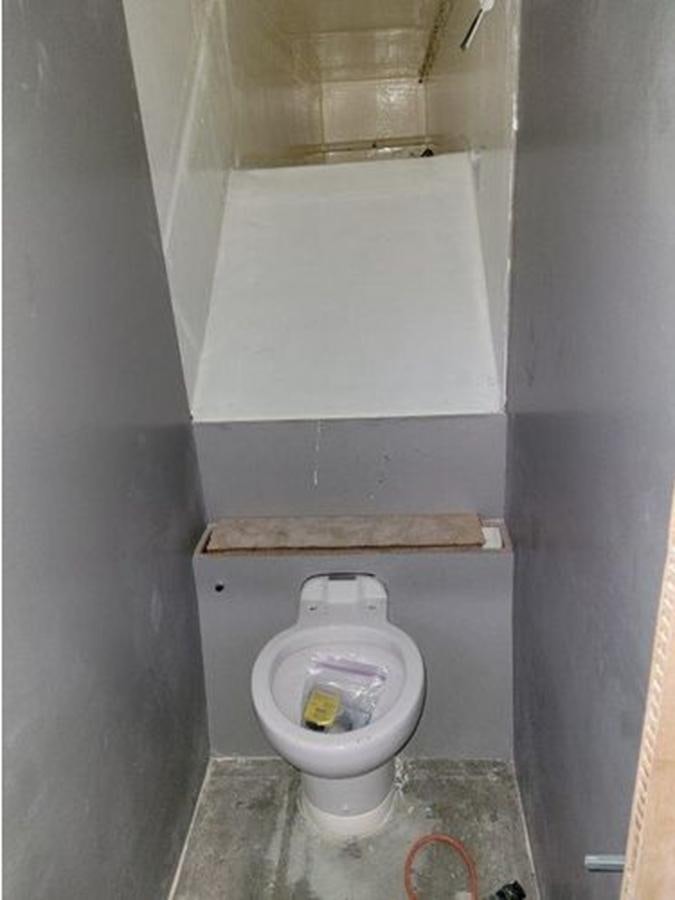 a dirty toilet in a dirty bathroom aboard 2023 PDIGREE CAT BLOOMFIELD Yacht for Sale