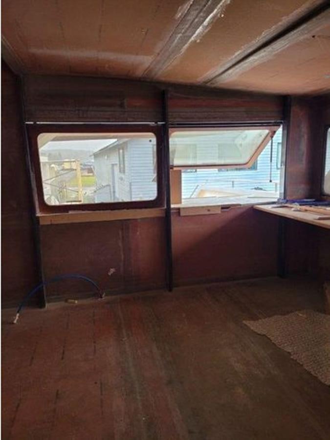 a room with a window and a table aboard 2023 PDIGREE CAT BLOOMFIELD Yacht for Sale