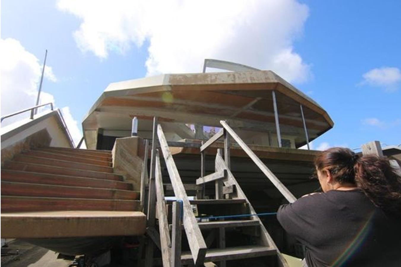 a person looking at a building aboard 2023 PDIGREE CAT BLOOMFIELD Yacht for Sale