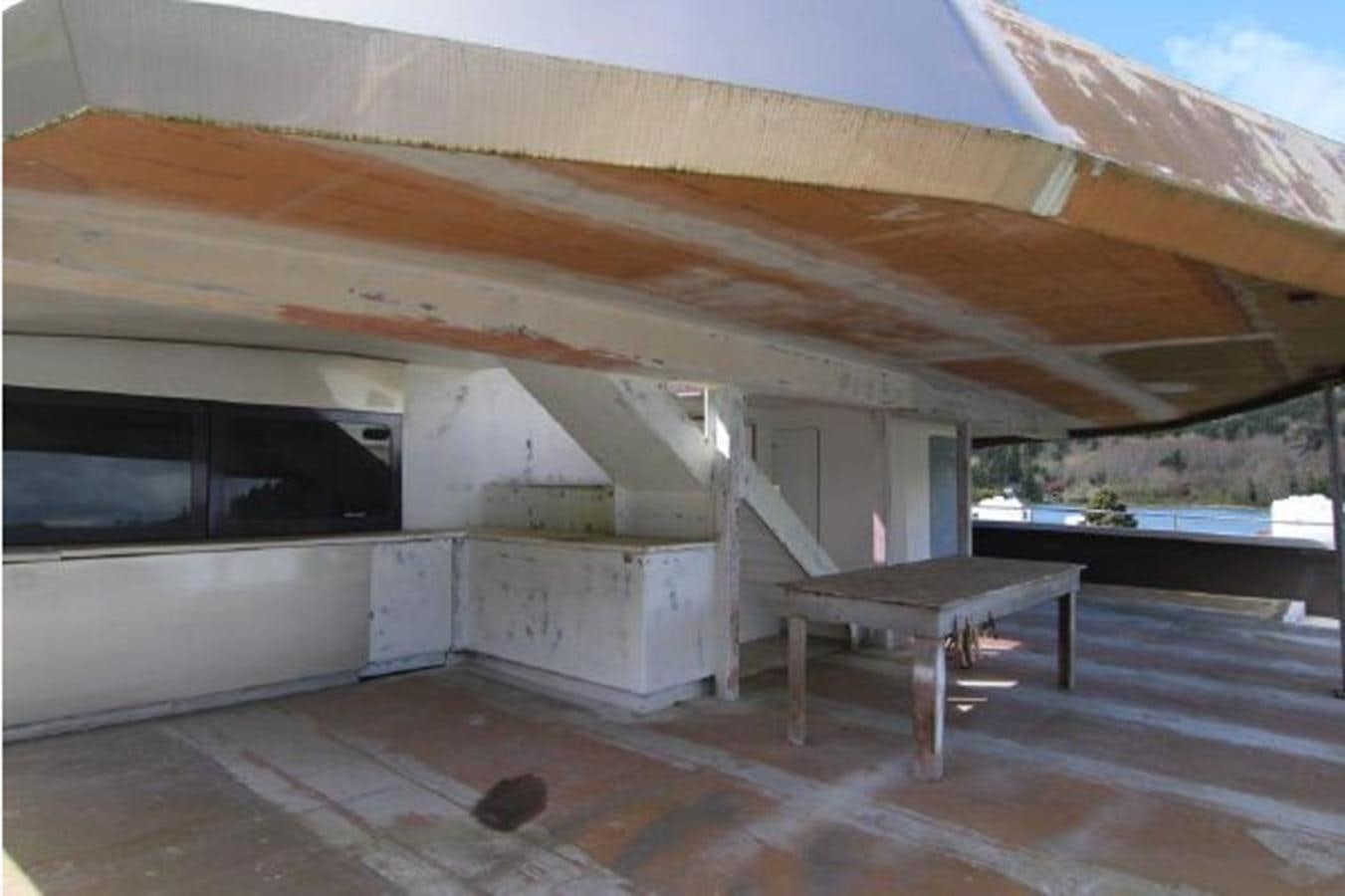 a house with a table and a bench aboard 2023 PDIGREE CAT BLOOMFIELD Yacht for Sale