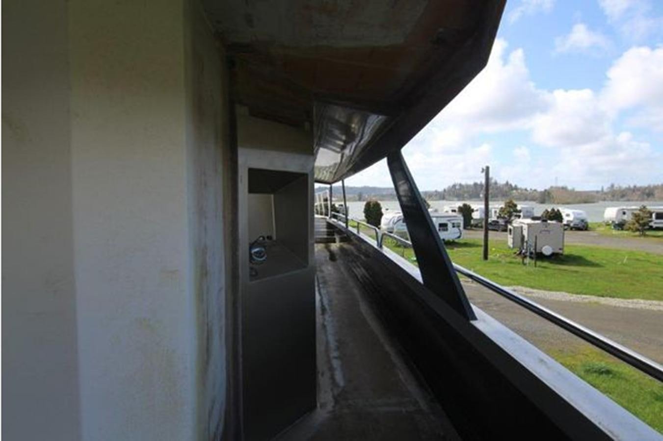 a view of a car parked on a road through a window aboard 2023 PDIGREE CAT BLOOMFIELD Yacht for Sale